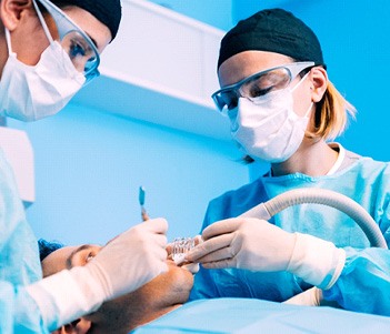 Dentists performing surgery