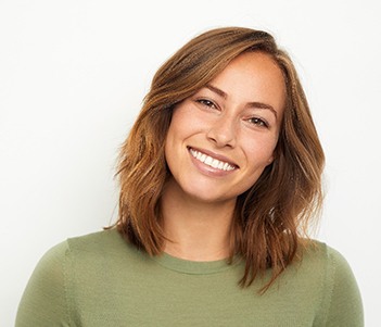 smiling person wearing a green shirt