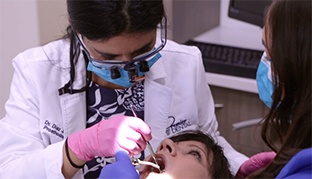 Dentist in Vero Beach treating a patient