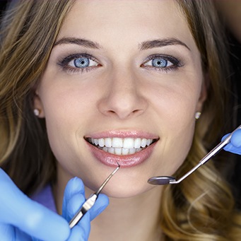 Woman receiving dental treatment