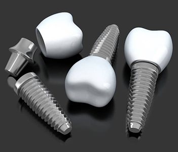 A digital image showing multiple dental implants lying on a table near each other