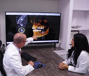 Woman in dental chair smiling