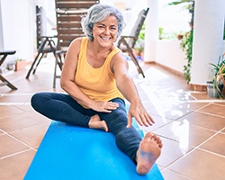 a person doing yoga outside on their patio