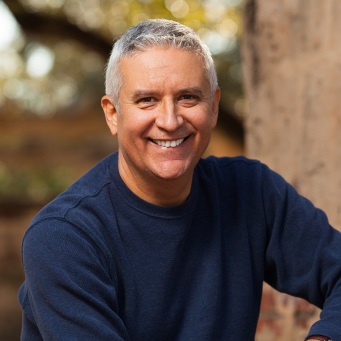 Older man smiling outdoors