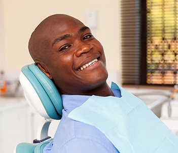 Smiling man in dental chair