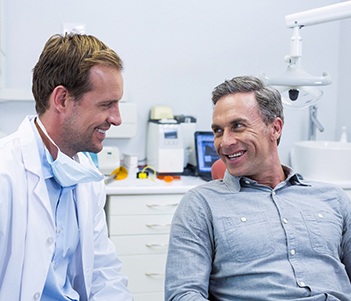 Smiling man talking to his Vero Beach sedation dentist 