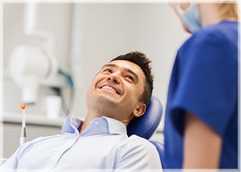 Smiling man in dental chair