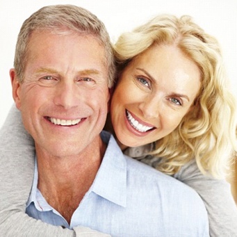 Couple smiling after receiving Teeth in a Day in Vero Beach