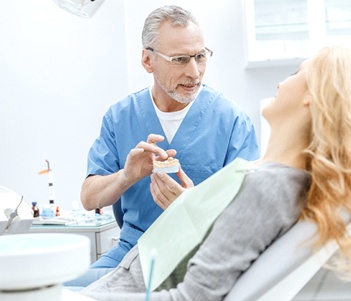 Dentist and patient discussing questions about dental implants