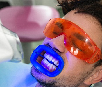 A young man having his teeth whitened