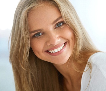 A young woman smiling