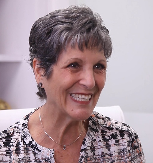 Smiling older woman in Vero Beach dental office