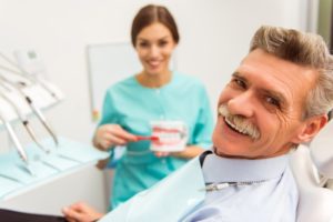 Smiling man using his dental savings plan in Vero Beach