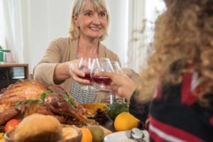 mature woman enjoying thanksgiving meal  