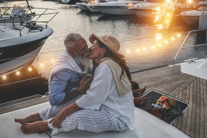 older couple kissing with dentures